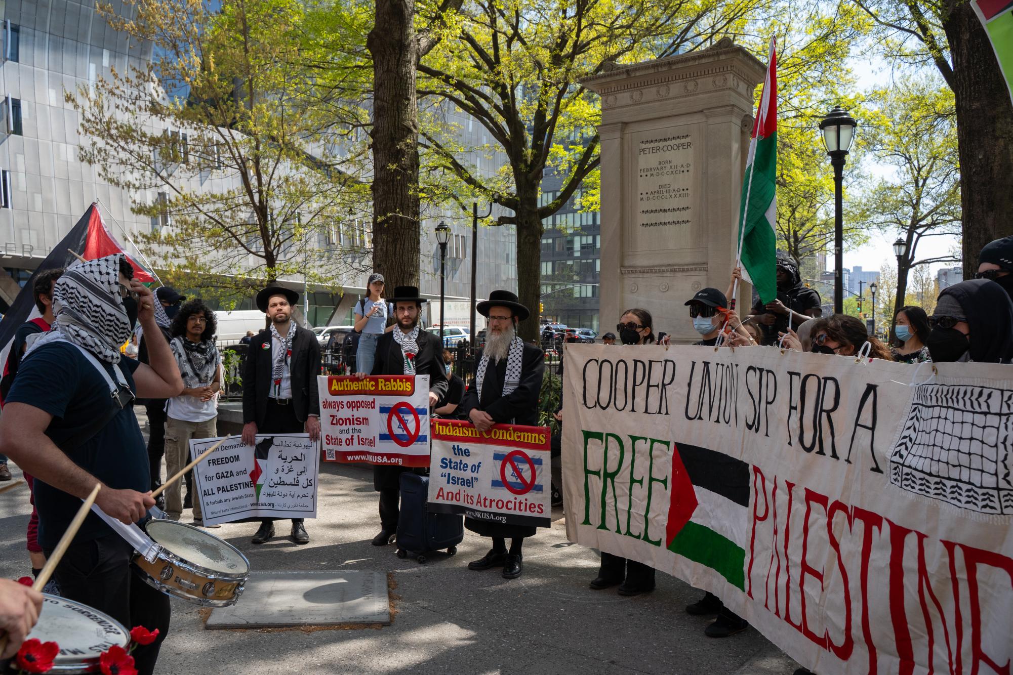 Students hold cross-campus march for divestment, noncitizen support