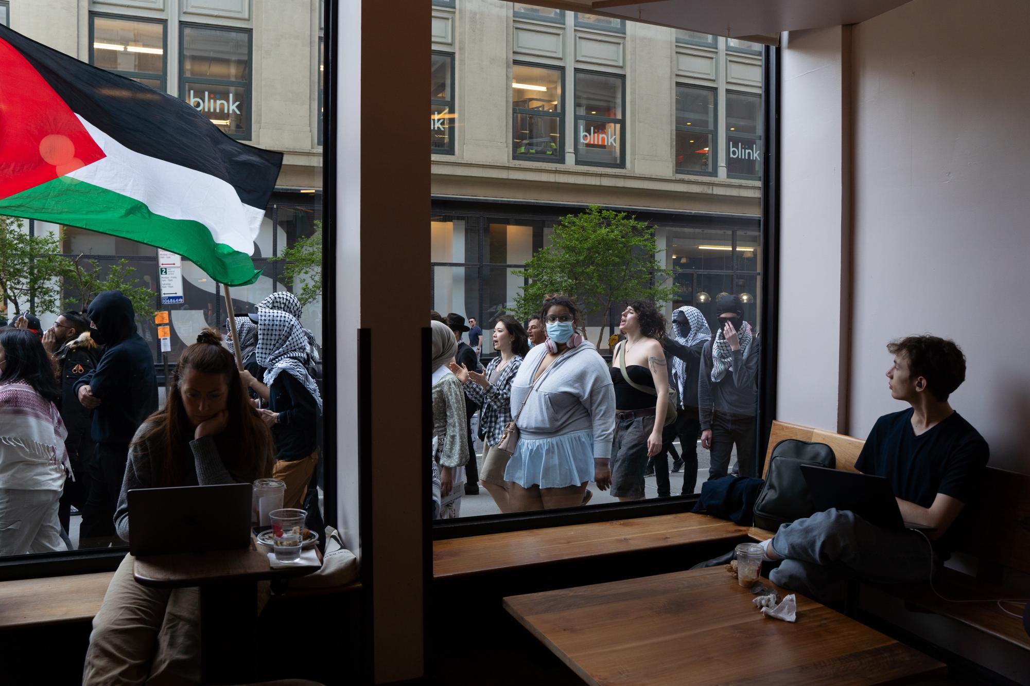 Students hold cross-campus march for divestment, noncitizen support